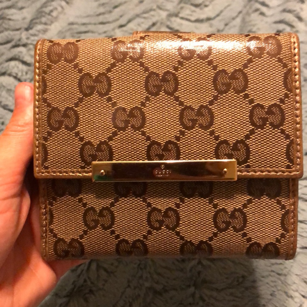 Gucci trifold wallet.